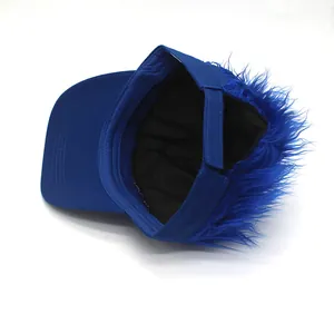 Detail of adjustable strap and fluffy blue synthetic hair on creative baseball wig hat