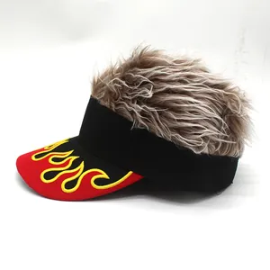 Detail of creative flame embroidery and textured messy wig on top of a baseball cap