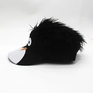 Detail of novelty sun visor featuring a funny cartoon bird face and black synthetic hair