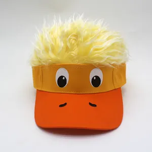 Detail of creative yellow duck sun visor with funny plush wig hair and cartoon embroidery