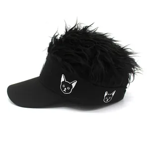 Close-up of baseball cap with creative spiky hair wig top and cat embroidery detail