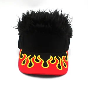 Detail of creative visor hat featuring black wig hair and flame embroidery on the brim