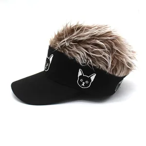Detail of cartoon dog embroidery on a black sun visor hat with brown messy wig hair