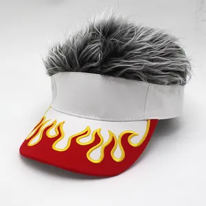 Detail of red flame embroidery and grey faux hair on white visor baseball cap