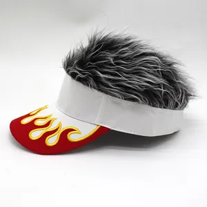 Detailed embroidery of gold flame pattern on red visor with attached black wig