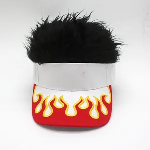Detail of red visor hat with flame embroidery and black synthetic wig hair on top