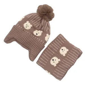 Brown knitted baby hat and scarf set with cute bear motifs and white polka dots