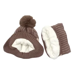 Brown knitted kids hat and neck warmer set with faux fur pompom and soft fleece lining
