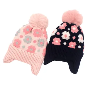 Bonnets tricotés hiver pour filles avec fleurs, doublure polaire, protège-oreilles et pompon