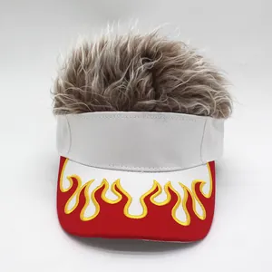 Detail of red and yellow flame embroidery on white visor cap with gray synthetic hair
