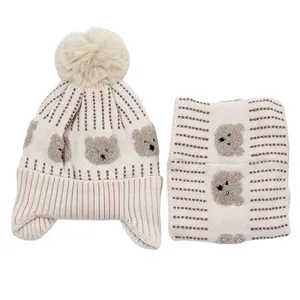 Winter knit set with bear embroidery, pompom earflap hat and matching neck warmer