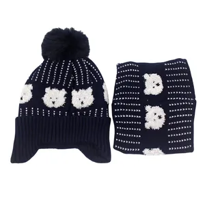 Kids knitted beanie and scarf set with cute bear pattern and plush pompom in navy blue