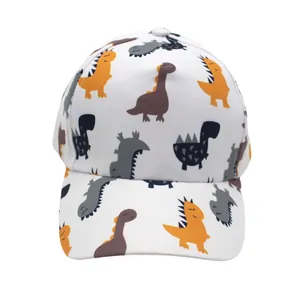 White kids baseball cap featuring colorful cartoon dinosaur prints for sun protection
