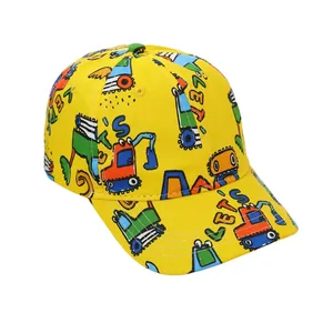 Detail of kids baseball cap featuring yellow canvas and cartoon excavator patterns