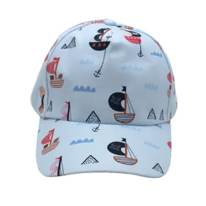 Front view of a light blue kids' baseball cap with nautical cartoon sailing prints