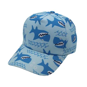 Detail view of light blue kids baseball cap with cartoon shark patterns and curved brim