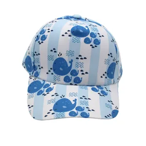 Detail of blue striped kids baseball cap featuring cartoon whale print and curved brim