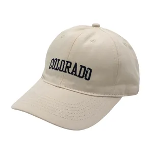 Detail of Colorado letter embroidery on beige cotton twill kids baseball cap