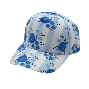 Detail of blue and white striped kids baseball cap with cute cartoon whale patterns
