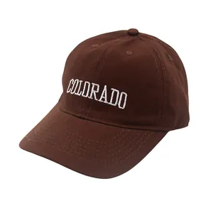 Detail of embroidered COLORADO text on deep brown cotton twill baseball cap for kids