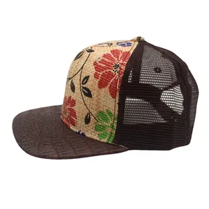 Detail of floral straw crown with crocodile texture brim and breathable mesh panel