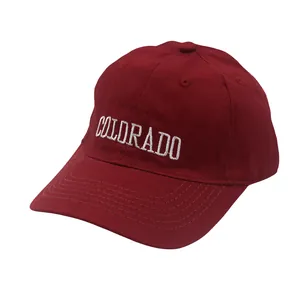 Detailed view of white Colorado letter embroidery on dark red cotton baseball cap