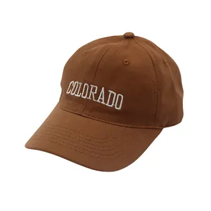 Close-up of brown cotton baseball cap with white COLORADO embroidery detail