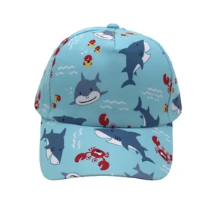 Close-up of kids baseball cap featuring blue sharks and sea life patterns on cotton fabric