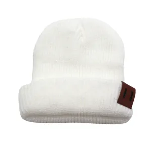 Classic white ribbed knit beanie for toddlers with a premium brown leather patch detail