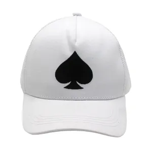 Macro view of black spade embroidery on white mesh truck cap with premium stitching