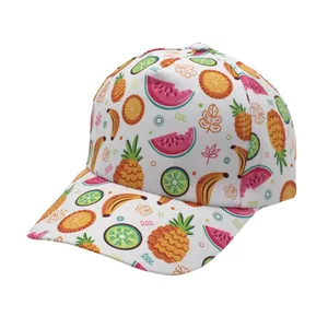 Close-up of kids baseball cap featuring vibrant tropical fruit patterns on white fabric