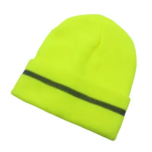 Close-up of neon yellow knit beanie showing reflective grey stripe for night safety