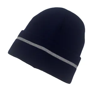 Detail of navy blue knitted beanie with silver gray reflective stripe for safety