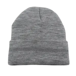Close-up of thick knitted beanie texture with wide fold-up cuff in dark grey