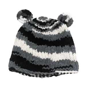 Detailed view of striped crochet beanie with cute bear ears and soft velvet texture