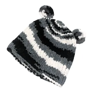 Detail of chunky knit striped hat with cute bear ears in black white and gray