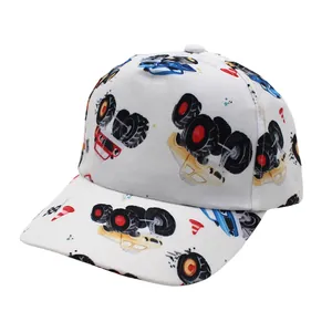 Detail of cartoon monster truck prints on white cotton kids baseball cap crown