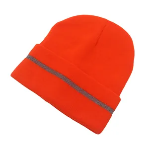 Detailed knit texture of orange reflective winter beanie for outdoor running