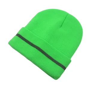 Detail of neon green reflective beanie showing knitted texture and silver stripes