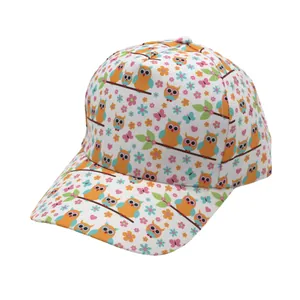 Detail of kids baseball cap featuring colorful cartoon owl and floral all-over print