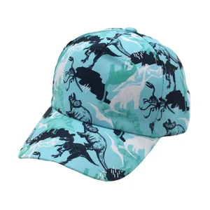 Detail view of cartoon dinosaur print silhouettes on a light blue kids baseball hat
