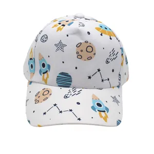Detail of kids baseball cap featuring all-over cartoon space, rockets and UFO prints