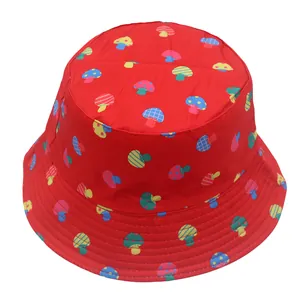 Detailed close-up of vibrant red bucket hat with colorful cartoon mushroom prints