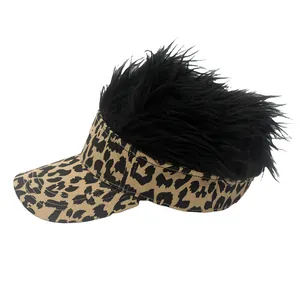 Detail view of adjustable leopard print visor hat with funny black wig hair on top