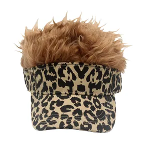 Detail of leopard print baseball cap with brown synthetic wig hair for costume party