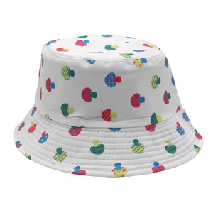Detailed view of colorful mushroom print and fine quilting on a white cotton bucket hat