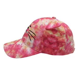 Detailed view of kids' tie-dye baseball cap with 3D cat ears and black whisker embroidery