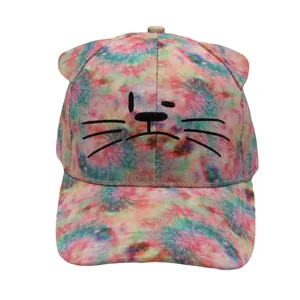 Detailed embroidery of cat face on a colorful tie-dye kids' baseball cap with ears