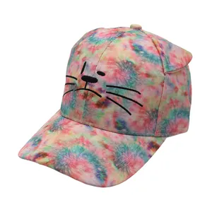 Detail view of colorful tie-dye kids baseball cap featuring 3D cat ears and embroidery