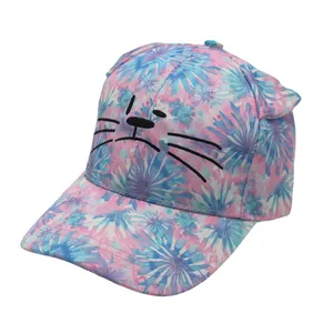 Close-up of cat embroidery and 3D ears on pink and blue tie-dye kids baseball cap